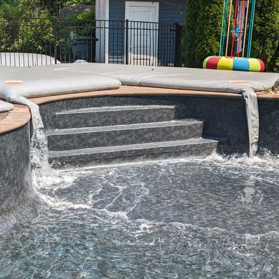 A picture of a pool filling with water from a Pool Bladder™