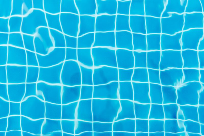 A pool liner with wavey looking lines.