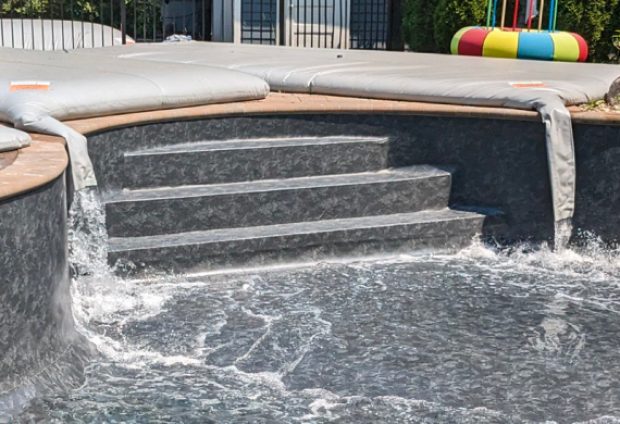 A picture of a pool filling with water from a Pool Bladder™